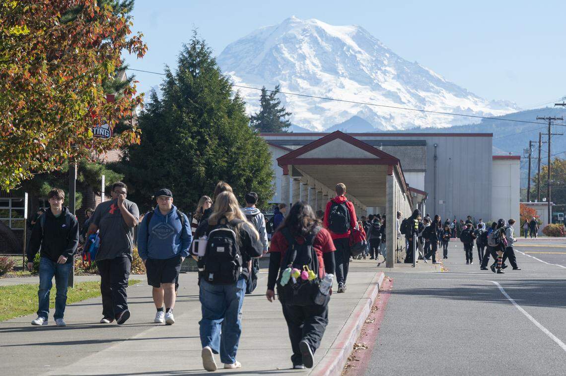Orting High School students walk to and from portables and the main Orting High School building on Wednesday, Oct. 15, 2025, in Orting, Wash.