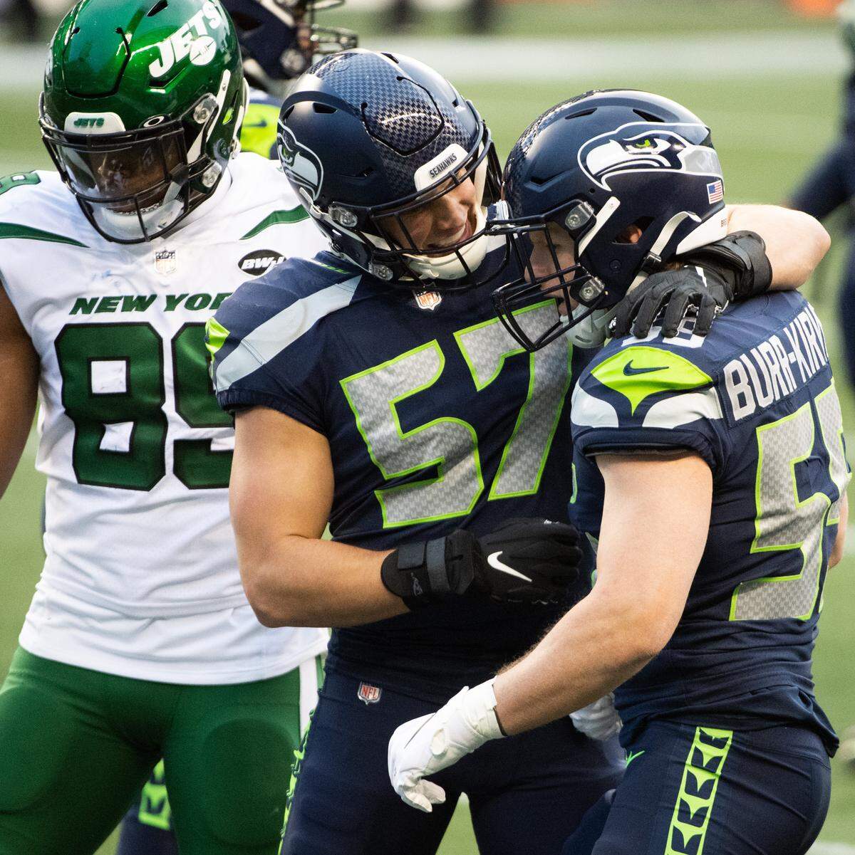 Seattle Seahawks linebacker Cody Barton and Seattle Seahawks linebacker Ben Burr-Kirven celebrate a big hit during the fourth quarter. The Seattle Seahawks played the New York Jets in a NFL football game at Lumen Field in Seattle, Wash., on Sunday, Dec. 13, 2020.