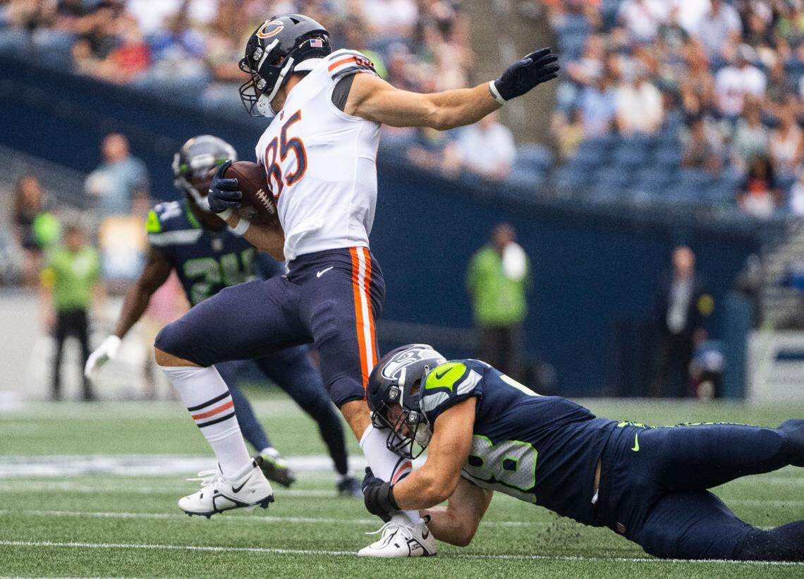 Seattle Seahawks linebacker Joel Dublanko (48) tries to tackle Chicago Bears tight end Cole Kmet (85) during the first half of the Seahawks second preseason game at Lumen Field in Seattle, Wash. on August 18, 2022.