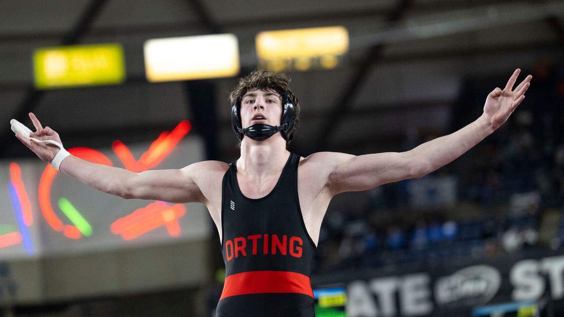 Orting’s Quentin Harding celebrates winning his fourth-straight state title after beating his Cardinal teammate William Lowery in the boys Class 2A, 157-pound state championship match on Saturday, Feb. 22, 2025, at Mat Classic XXXVI at the Tacoma Dome in Tacoma, Wash.