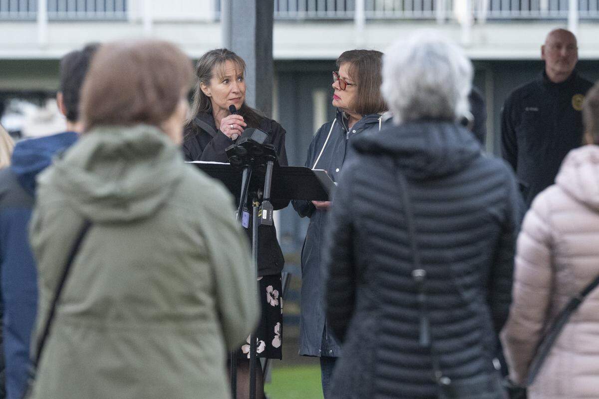Pierce County Council member Robyn Denson, left, and Gig Harbor mayor Mary Barber speak at a memorial for the victims of last month's stabbing attack on Wednesday, March 4, 2026, in Gig Harbor, Wash.