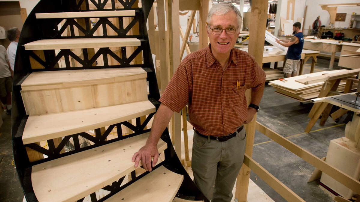 Belina Interiors president Paul Birkey stands next to a staircase at his company built for a luxury yacht at Belina Interiors in Tacoma on Tuesday, August 27, 2013. Photo by Lui Kit Wong/Staff photographer
