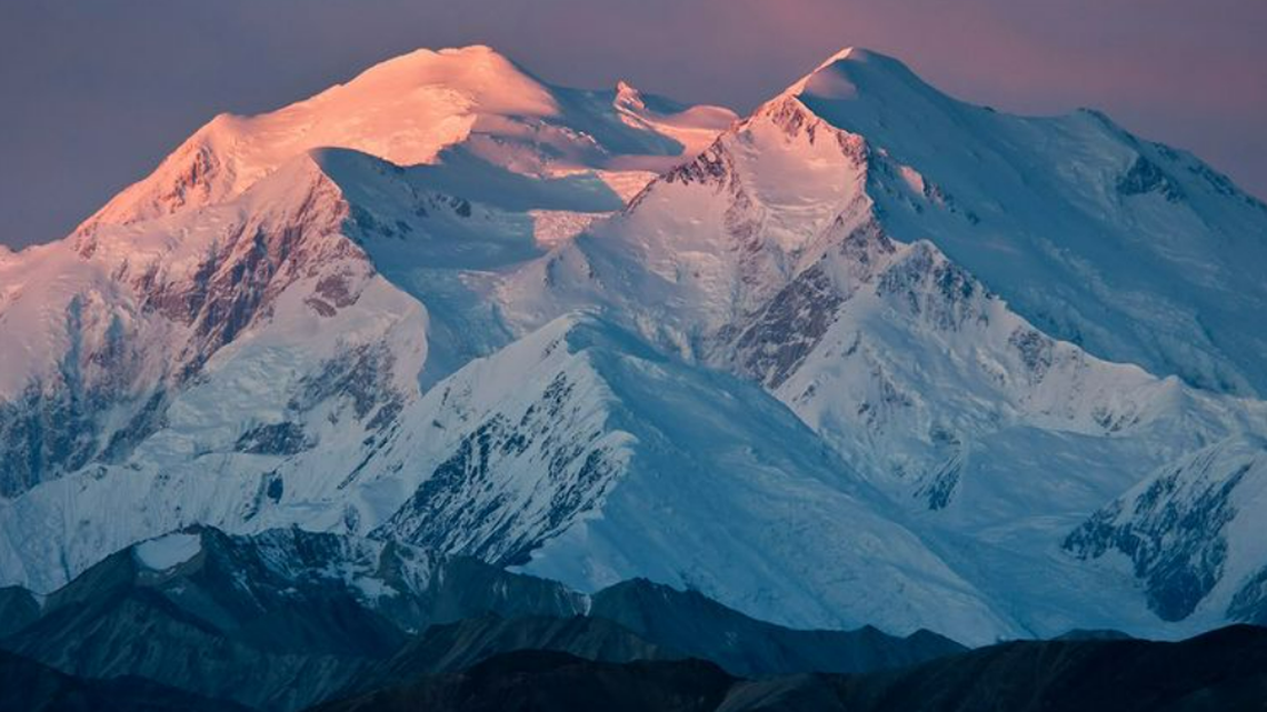 In this photo, Denali mountain in Alaska is shown — the highest mountain peak in North America. A Utah doctor is accused of lying to the National Park Service to have him and other climbers airlifted from the mountain on May 24, 2021.