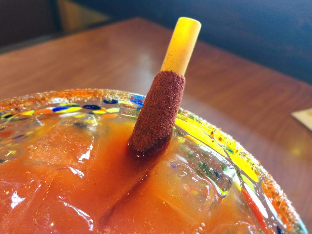 A tart and sweet tamarind straw is the final touch on the Mango Chamoy Margarita at El Toro.