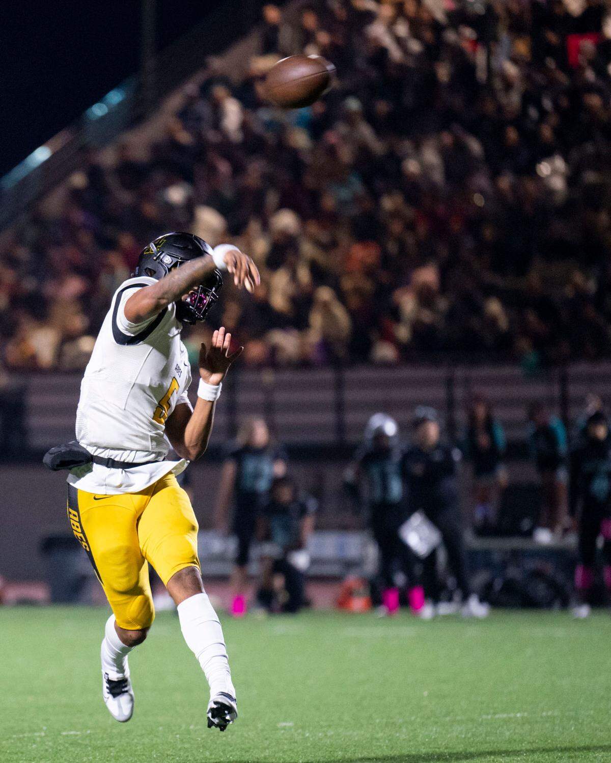 Lincoln quarterback Gabarri Johnson throws a touchdown pass to receiver DJ Ervin during the second quarter of a 3A PCL game against Spanaway Lake on Friday, Oct. 28, 2022, at Art Crate Field in Spanaway, Wash.