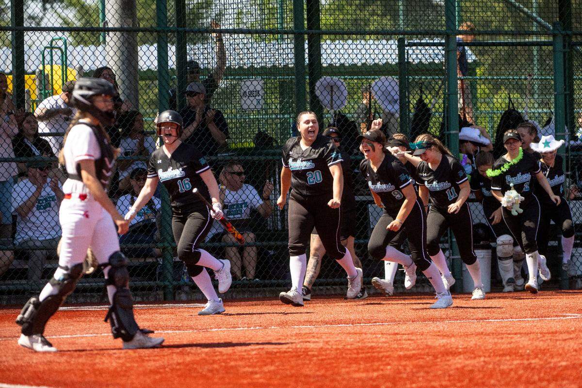 Bonney Lake players come out of the dugout to celebrate after Isabella Jones hit a home run first inning of a second-round game of the Class 3A state softball tournament against Stanwood on Friday, May 26, 2023, in Lacey, Wash.