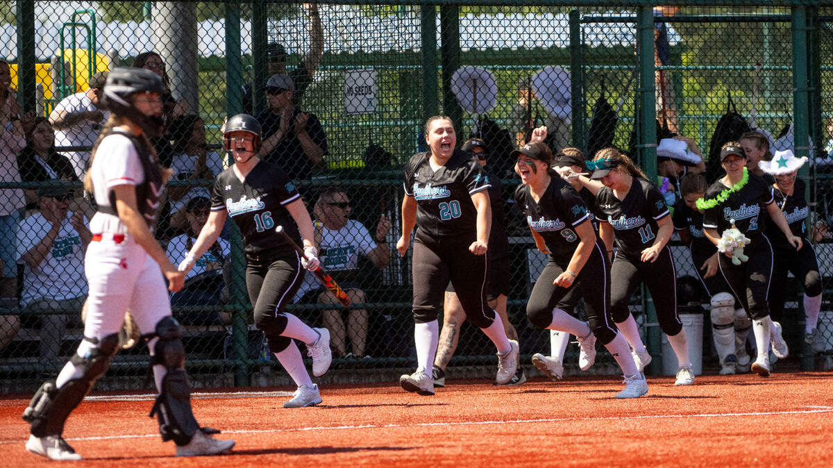 Bonney Lake players come out of the dugout to celebrate after Isabella Jones hit a home run first inning of a second-round game of the Class 3A state softball tournament against Stanwood on Friday, May 26, 2023, in Lacey, Wash.