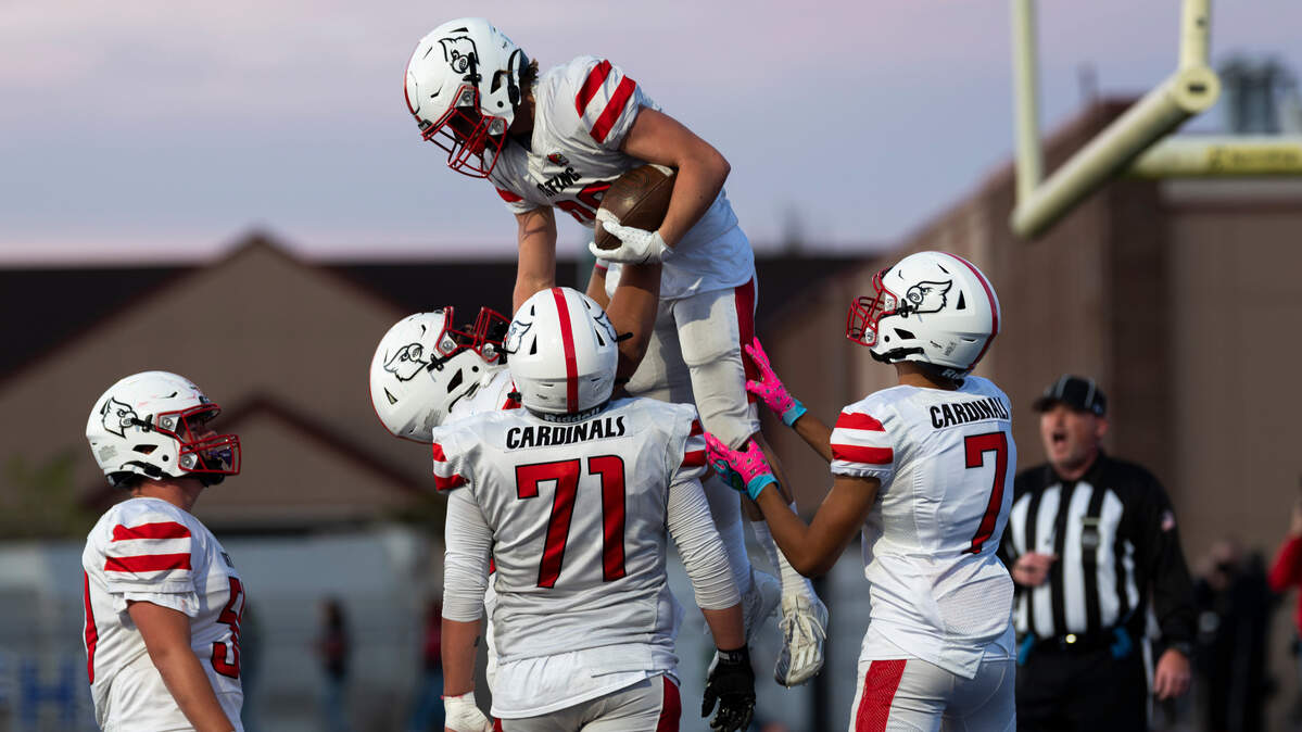 Orting’s Brock Armstrong (20) gets lifted up by teammates after running in a touchdown against Fife during the first half of the game at Fife High School, on Friday, Sept. 20, 2024, in Fife, Wash.