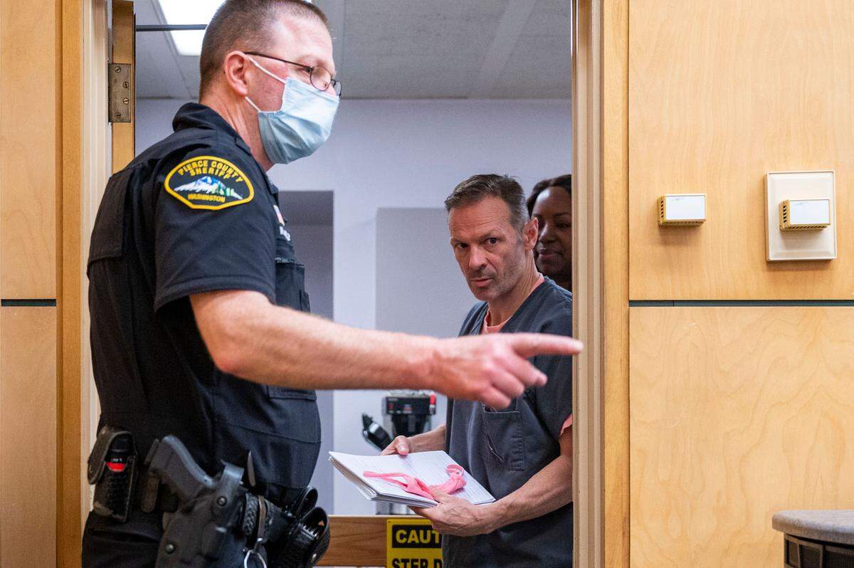 Owen Ray, a former colonel in the U.S. Army at Joint Base Lewis-McChord, enters a Pierce County Superior Court room prior to his sentencing hearing on Friday, Oct. 28, 2022, in Tacoma, Wash.