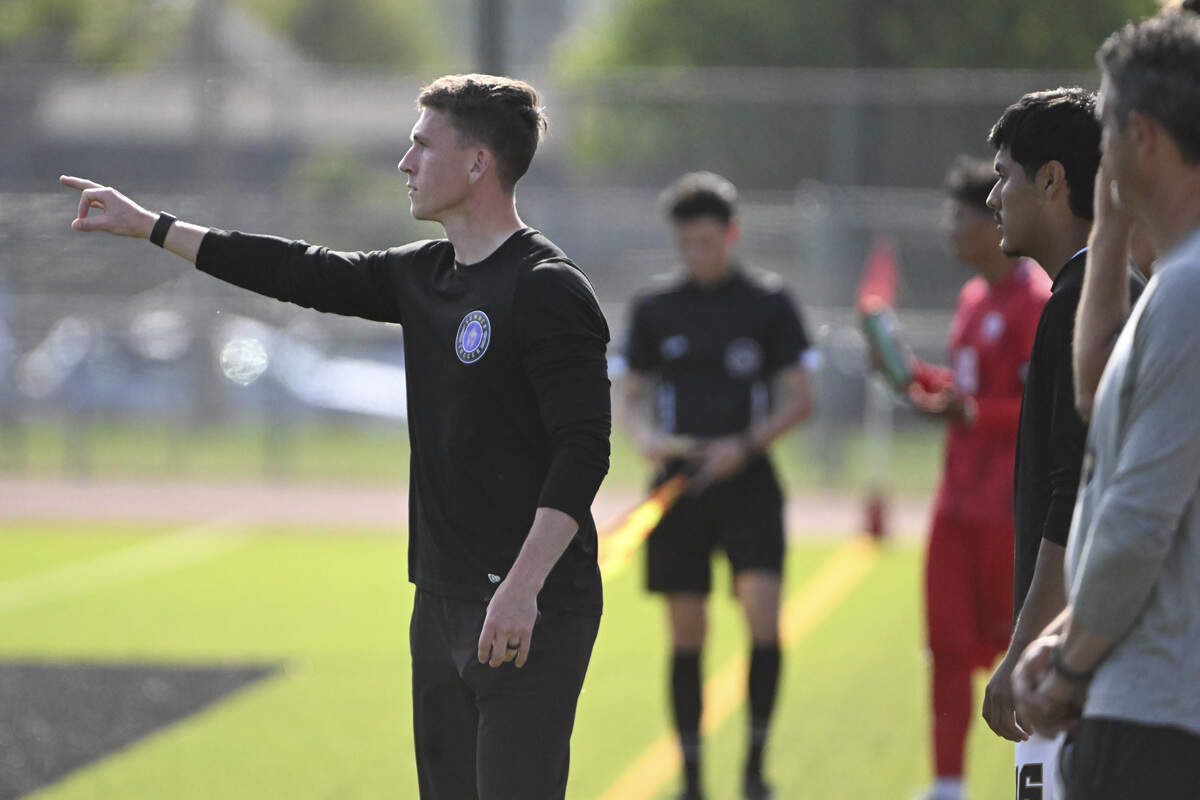 Sumner head coach Craig Johnson, left, calls out to players from the sideline of a game against Eastmont in the 2026 4A Boys Soccer Championships final on Saturday, May 30, 2026, during the in Puyallup, Wash.