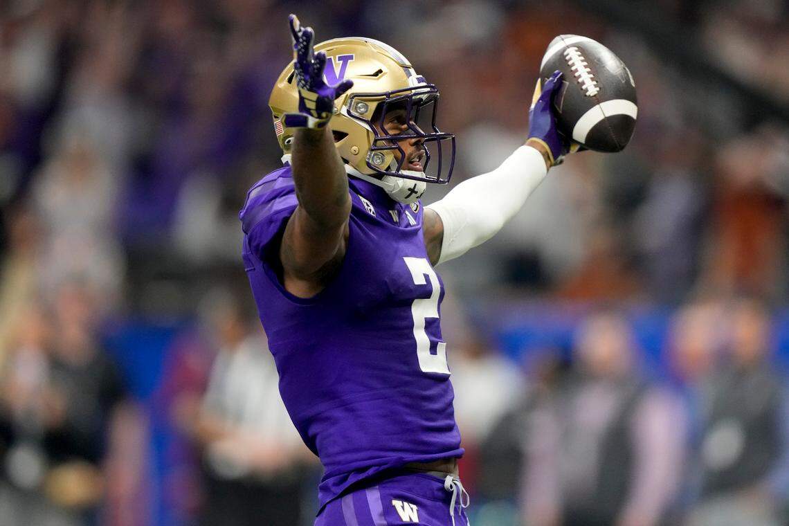 Washington wide receiver Ja’Lynn Polk (2) celebrates his touchdown against Texas during the first half of the Sugar Bowl CFP NCAA semifinal college football game, Monday, Jan. 1, 2024, in New Orleans. (AP Photo/Gerald Herbert)