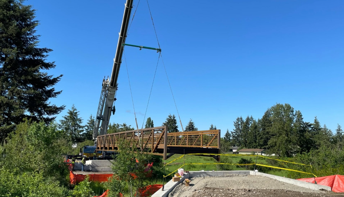 Bridge being installed over Clover Creek in Parkland Prairie.