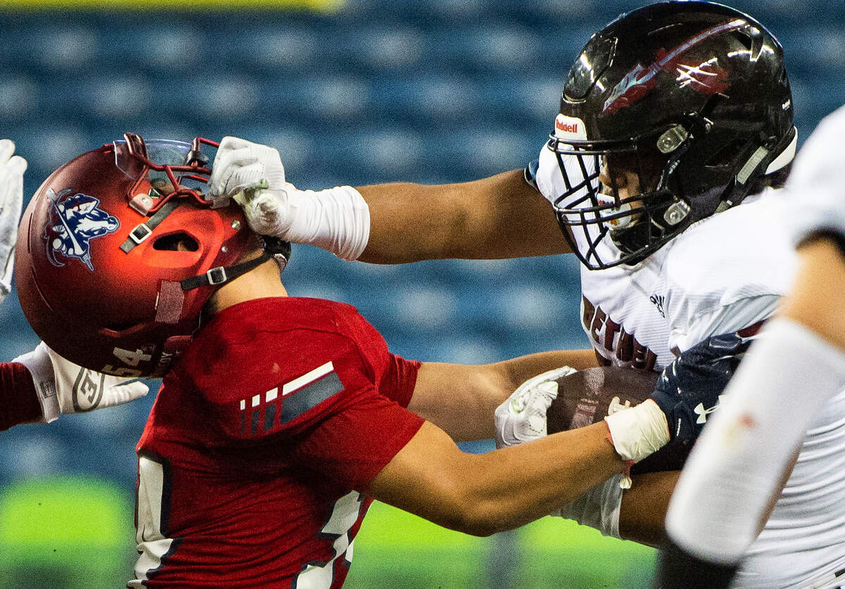 Bethel’s Will Latu (11) stiff arms Kennedy Catholic’s Shane Aleaga. Kennedy Catholic played Bethel in a high school football game at CenturyLink Field in Seattle, Wash., on Friday, Sept. 6, 2019.
