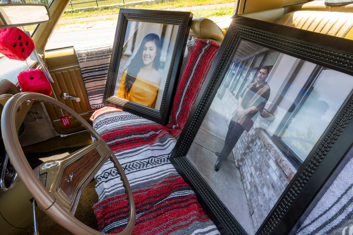 Photos of Giselle Soto, left, who lost her life to vehicular homicide at age 16, and Samuel Antonio Garza Gonzalez, who was killed in a shooting at age 24, sit in the front seat of Elisa Gonzalez’s car on Thursday, June 5, 2025, in Tacoma, Wash. Samuel and Soto’s death and Samuel’s love for cars inspired the creation of nonprofit women’s car club Unidas Por Vida, which provides services and resources to people who have lost loved ones to homicide in Pierce County.