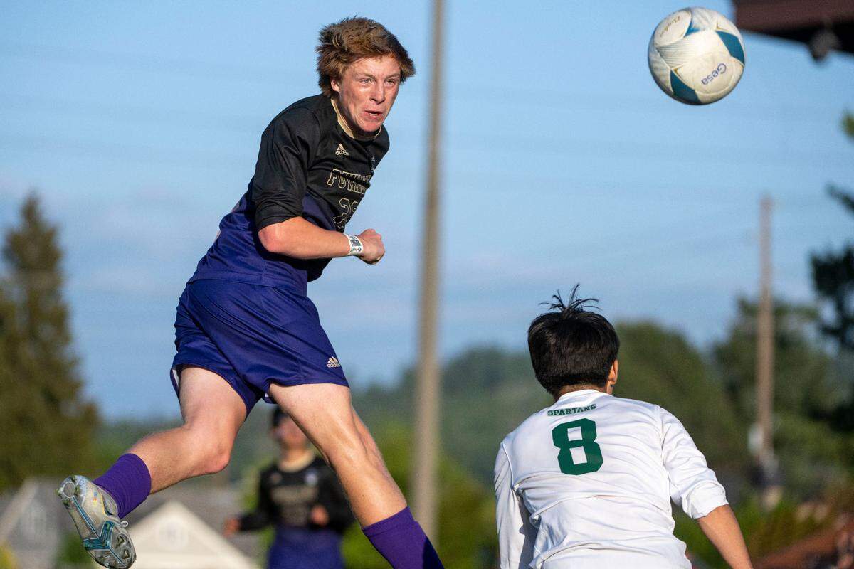 Puyallup’s Zack Robertson watches as his header misses the mark during the second half of the Class 4A state championship game against Skyline on Saturday, May 27, 2023, at Sparks Stadium in Puyallup, Wash.
