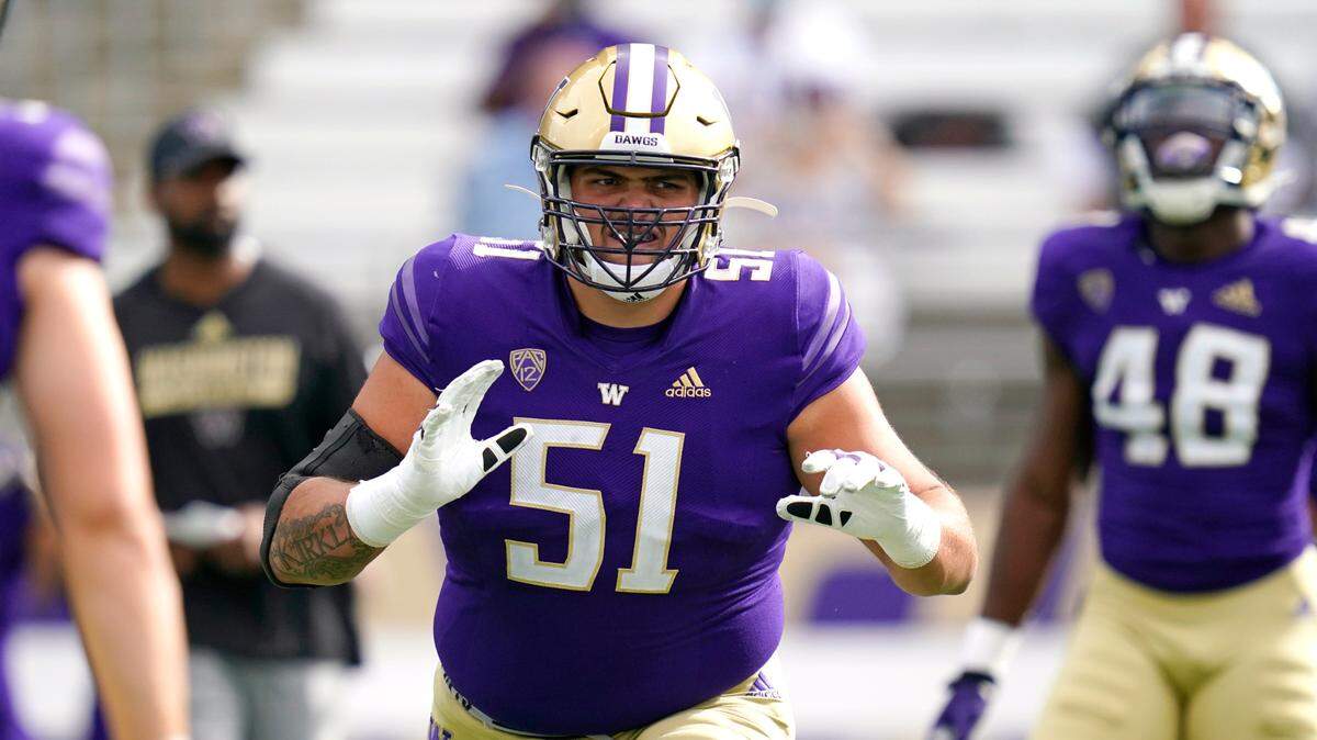 Washington’s Jaxson Kirkland warms-up before an NCAA college football game against Montana Saturday, Sept. 4, 2021, in Seattle. (AP Photo/Elaine Thompson)