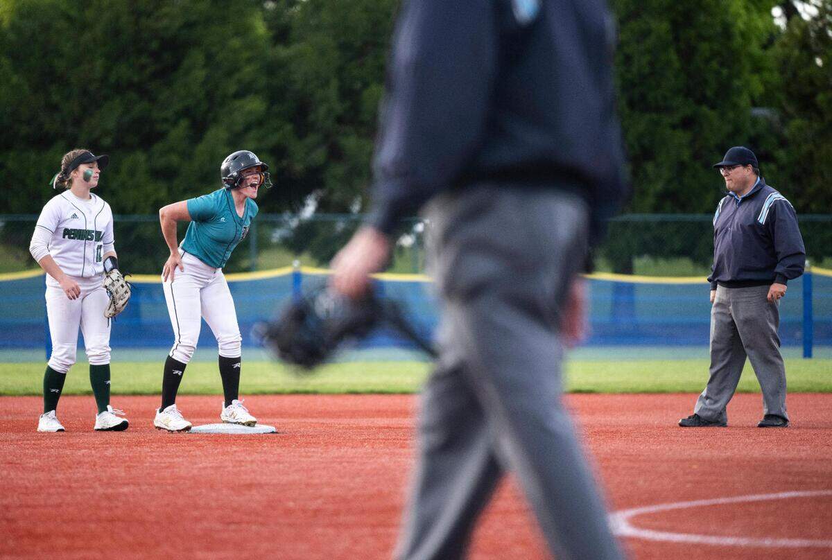 Bonney Lake’s Kyla Cross, 8, cheers after being advanced to second base by an error during the seventh inning of the 3A state softball tournament quarterfinals at the Regional Athletic Complex on Friday, May 27, 2022 in Olympia, Wash. Bonney Lake defeated Peninsula 3-2 with a triple play in the seventh inning to win the quarterfinal game.
