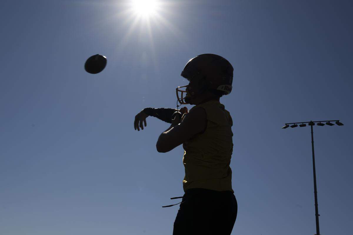 Capital quarterback Nolan Potts throws during a football practice at Capital High School on Friday, Aug. 22, 2025, in Olympia, Wash.