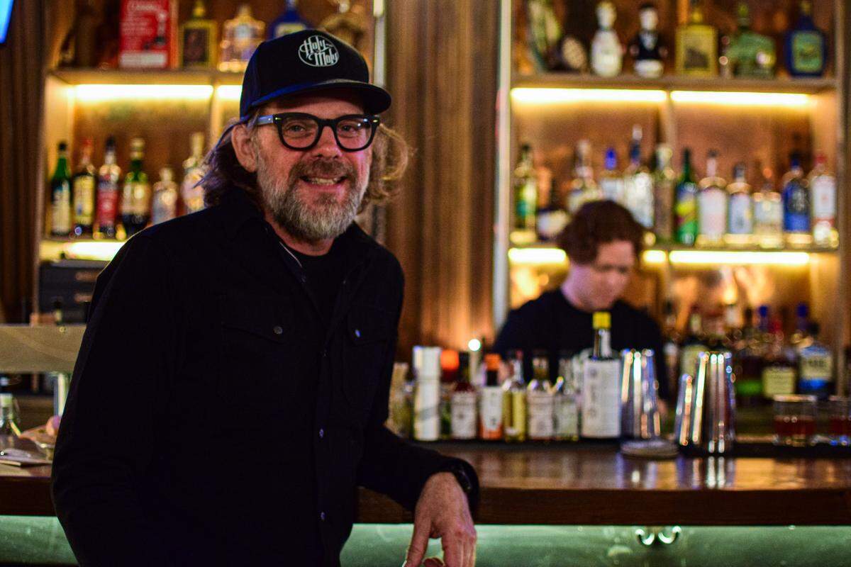 Owner Matt Coppins, shown here on Oct. 10, found the arched wooden panels that anchor the bar at Earthwise Salvage in Seattle.