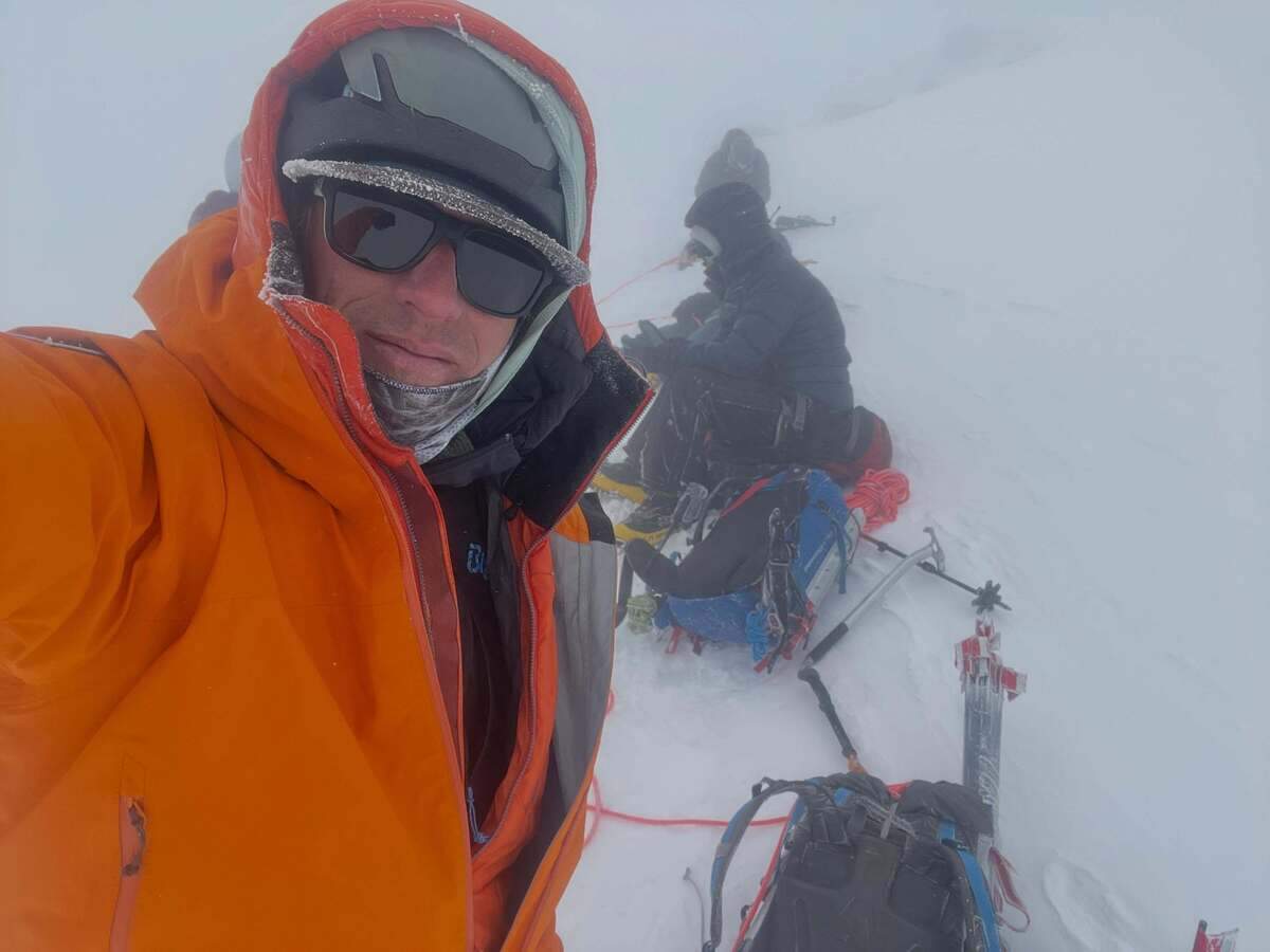 Mike King on his 98th summit of Mount Rainier. Not a clear morning. “Nothing is a given up there.”