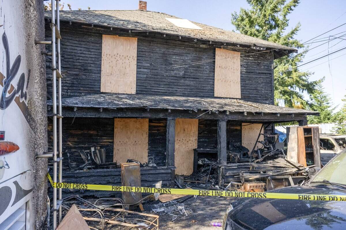 Barrier tape remains hanging where an electrical fire claimed the Brooks family's house, motorhome and two family cars the weekend prior, pictured on Thursday, Sept. 18, 2025, in Tacoma.