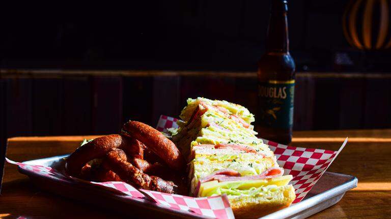 The biggest club sando you’ve maybe ever seen can be found at Tacoma dive bar