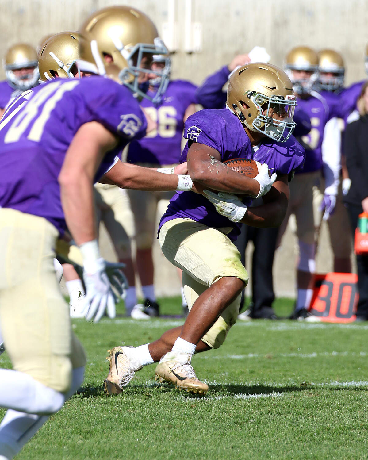 Carroll College running back Major Ali, a Peninsula High School grad, averaged 5.2 yards per carry last season for the Fighting Saints.