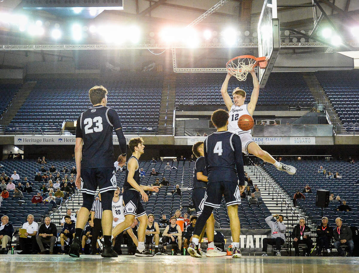 Olympia’s Jackson Grant throws down a dunk during the second quarter. Olympia played Skyview in a basketball game at Hardwood Classic at the Tacoma Dome in Tacoma, Wash., on Friday, March 6, 2020.