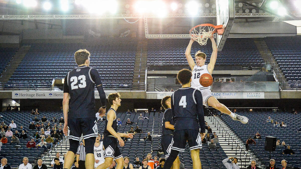 Olympia’s Jackson Grant throws down a dunk during the second quarter. Olympia played Skyview in a basketball game at Hardwood Classic at the Tacoma Dome in Tacoma, Wash., on Friday, March 6, 2020.