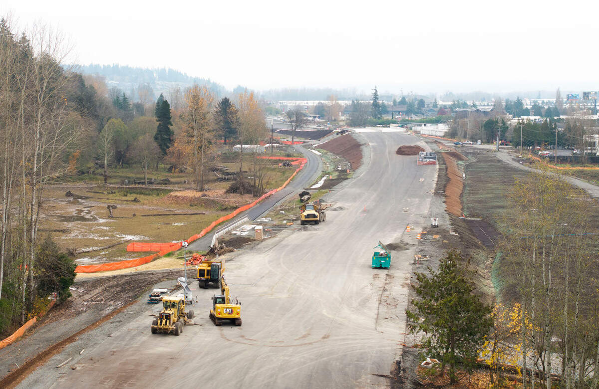 Construction crews work on a toll road that will connect State Route 509 and I-5, on Monday, Dec. 2, 2024, in Tacoma.