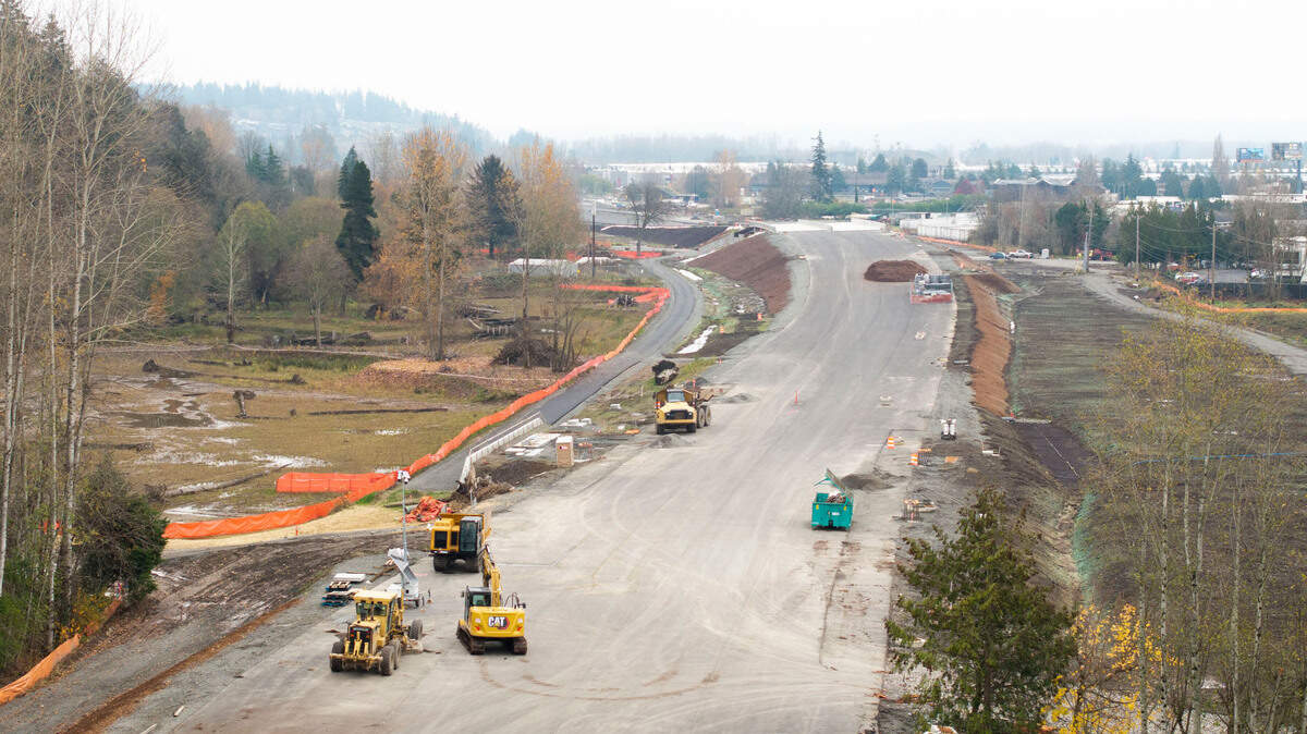 Construction crews work on a toll road that will connect SR 509 and I-5, on Monday, Dec. 2, 2024, in Tacoma, Wash.