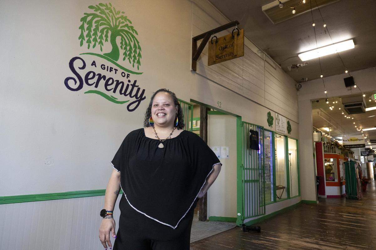 Owner Allaric “AJ” Say'shianda stands outside of A Gift of Serenity, a gift store at Freighthouse Square on Wednesday, Jan. 21, 2026, in Tacoma, Wash. The shop sells handmade jewelry, clothing and decor made by the owner and 20 other Tacoma and PNW artists.