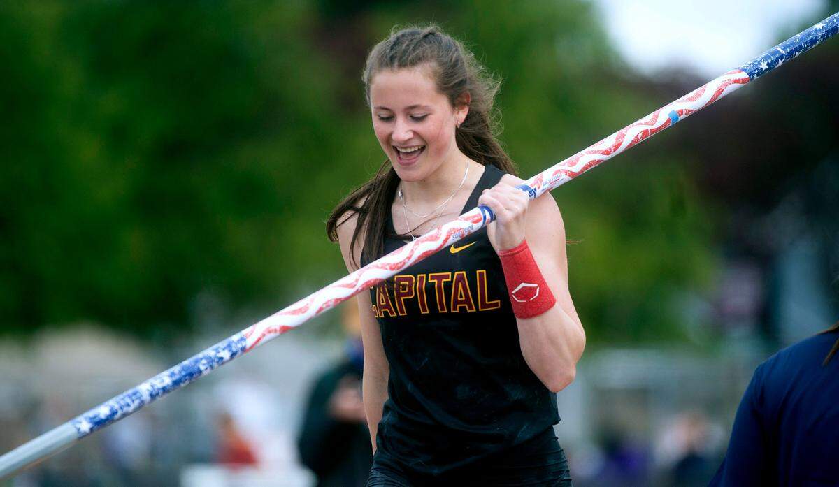 Capital junior Amanda Moll smiles after clearing the bar at 14’ 6” to win the 3A girls pole vault competition during the second day of the WIAA State Track and Field Championships at Mount Tahoma High School in Tacoma, Washington on Friday, May 27, 2022.