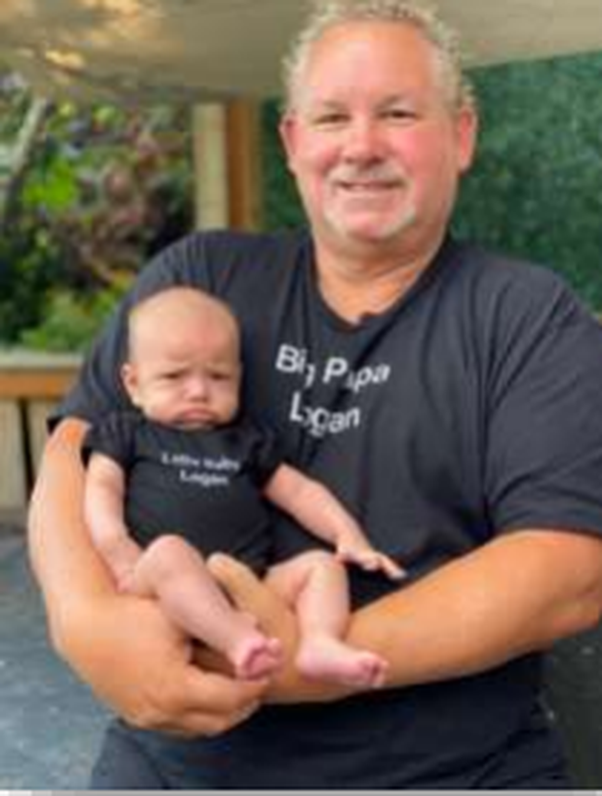 Robert Logan, who drowned after a whirlpool sucked him into a culvert at Titlow Park in July 2024, is seen with a grandchild in this undated photo.