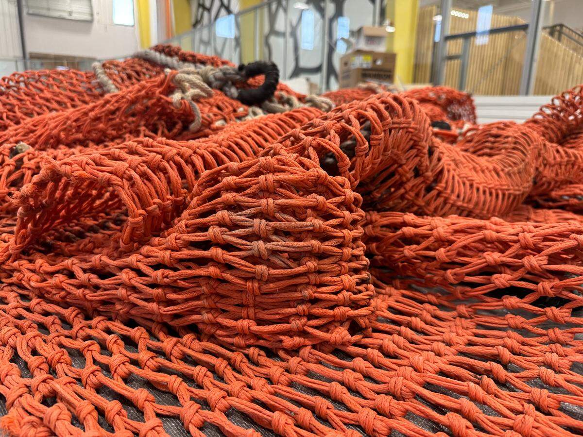 An orange fishing net donated by the Harbor History Museum will stop errant balls from bouncing from the sports courts into the lobby inside PenMet Parks’ new Recreation Center, opening in the Gig Harbor area in 2025.
