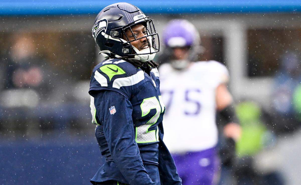 Seattle Seahawks cornerback Riq Woolen (27) reacts to shutting down Minnesota Vikings wide receiver Jordan Addison (3) during the first quarter of the first quarter of the game at Lumen Field, on Sunday, Dec. 22, 2024, in Seattle, Wash.