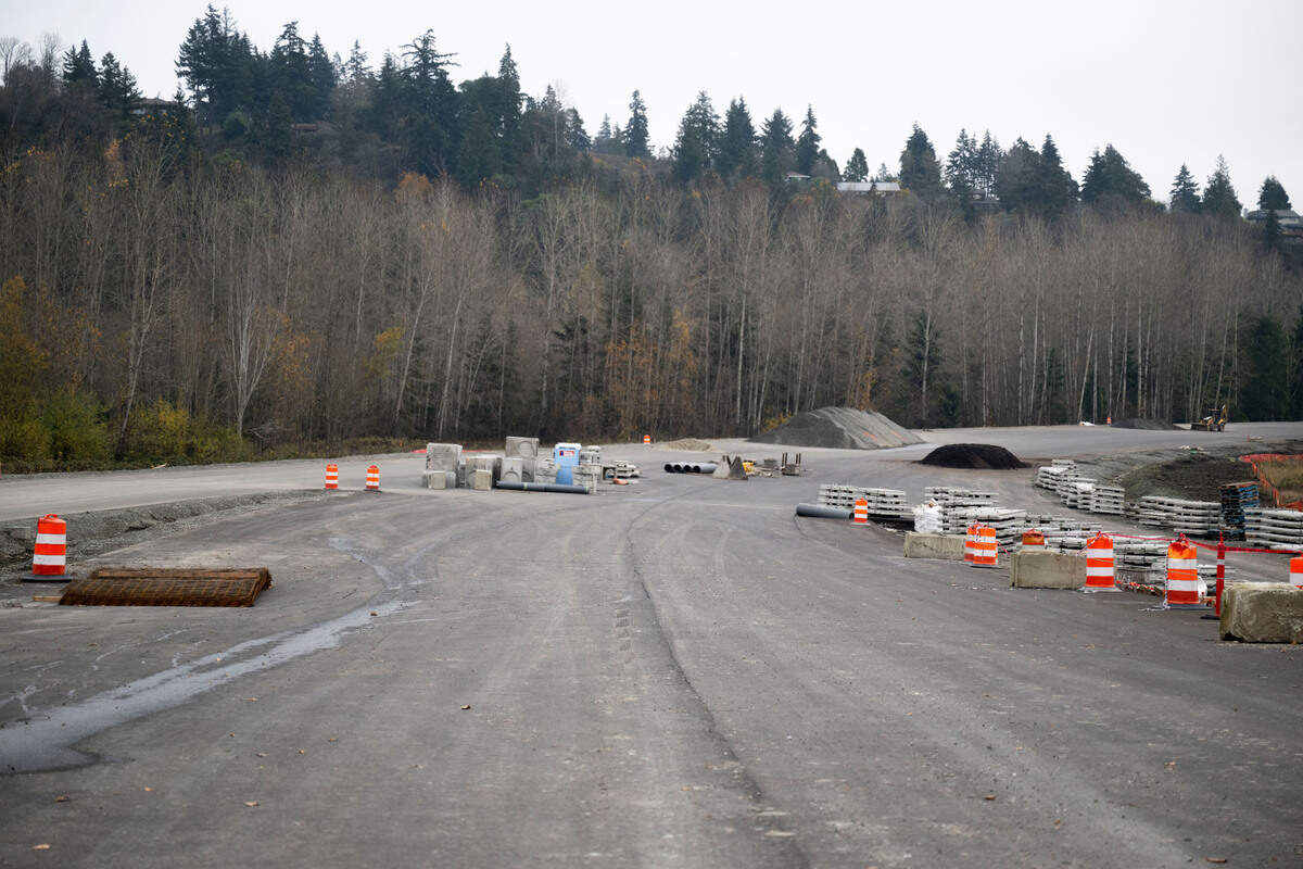 Construction crews work on a toll road that will connect State Route 509 and I-5, on Monday, Dec. 2, 2024, in Tacoma.
