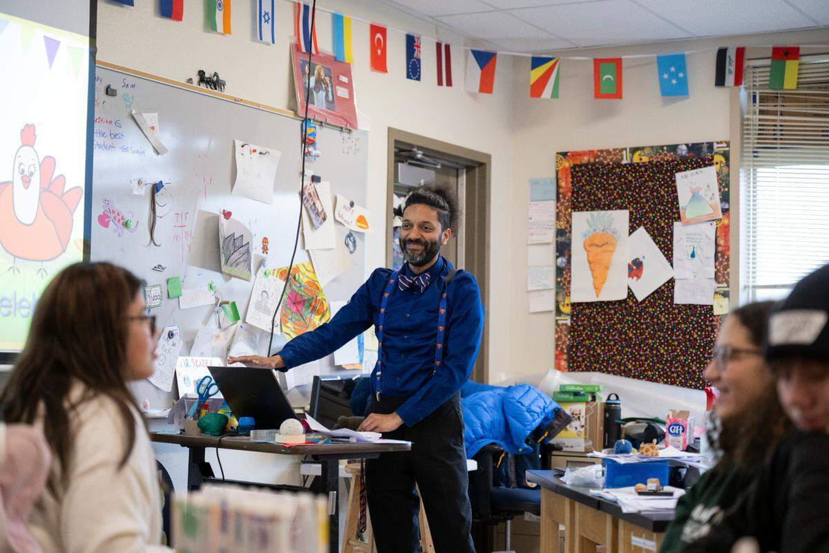 Elliot Scaife, science teacher and adviser for the BIPOC Club, sings a birthday song to one of the students in the BIPOC Club meeting at Orting Middle School, on Wednesday, March 6, 2024, in Orting, Wash.