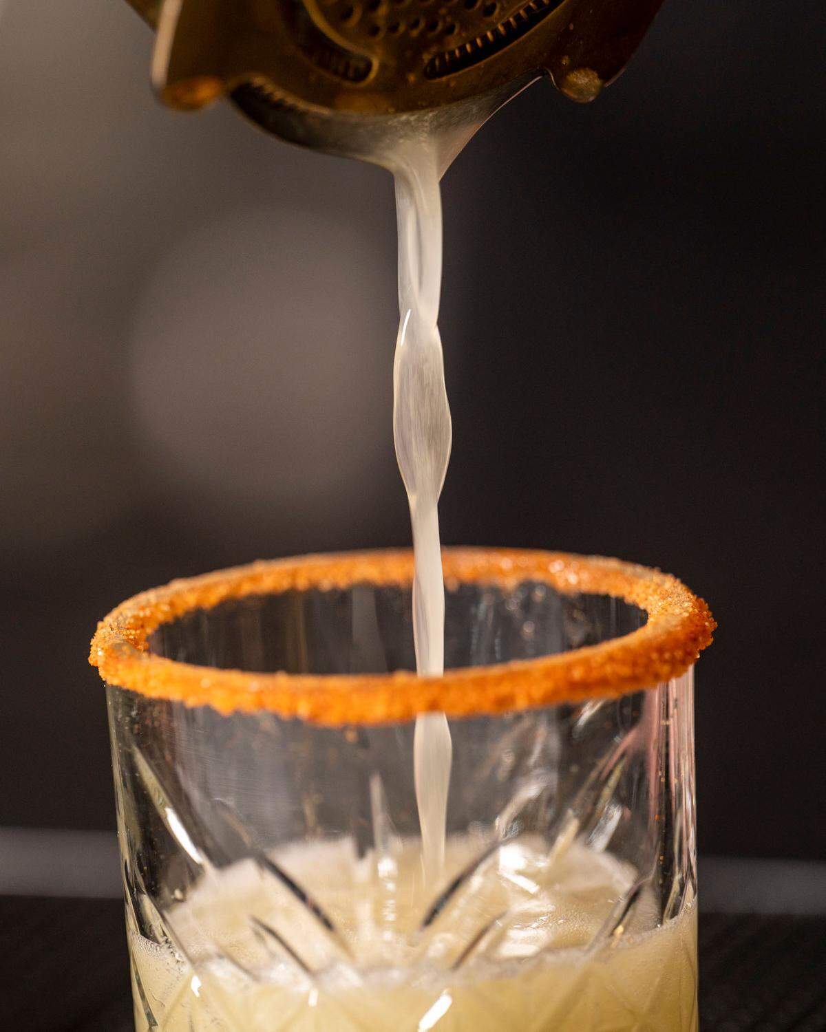 ALMA Lounge in Tacoma, Wash., serves contemporary indigenous foods alongside cocktails by food and beverage director Megan Henson. Here a winter refresher featuring tequila and oloroso sherry, is poured into a glass with a sal de gusano rim.