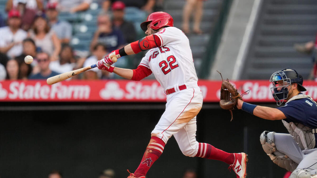 Los Angeles Angels’ David Fletcher (22) doubles during the second inning of a baseball game against the Seattle Mariners Saturday, July 17, 2021, in Anaheim, Calif. Taylor Ward, Juan Lagares, and Jack Mayfield scored. (AP Photo/Ashley Landis)