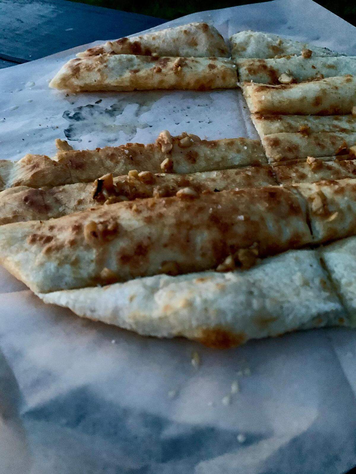 The Roman Pizza Bianca from Sirius Wood Fired Pizza, a food truck and catering company based in Puyallup, Washington, is perfectly simple pizza at its finest, with garlic roasted in the wood-fired oven, salt and a three-day, cold-fermented dough.