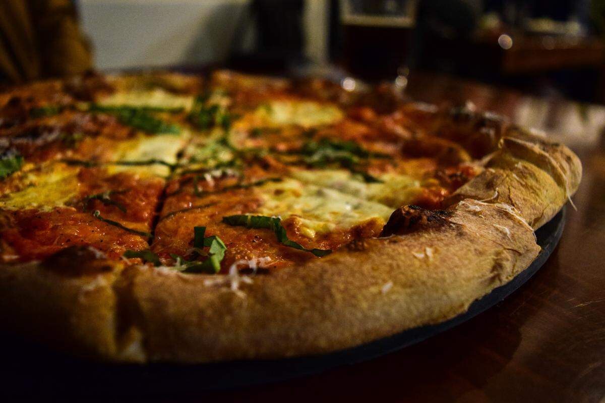 Millville Pizza Co. in Gig Harbor, Washington, serves wood-fired pies and panuozzo, an Italian street sandwich made from the same pizza dough.