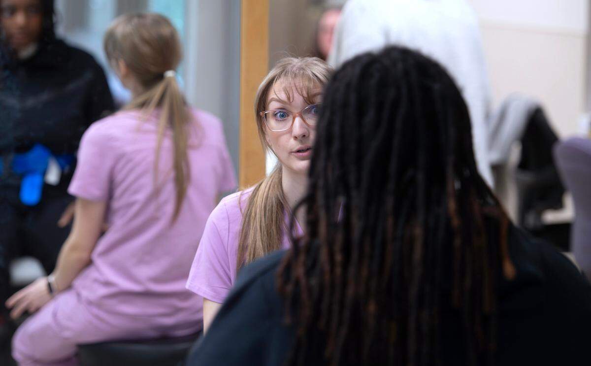 Physical therapist assistant Mary Hagen works with Shaunece Yates of Seattle in the Rehabilitation Center at Good Samaritan Hospital in Puyallup, Washington, on Thursday, Dec. 12, 2024.