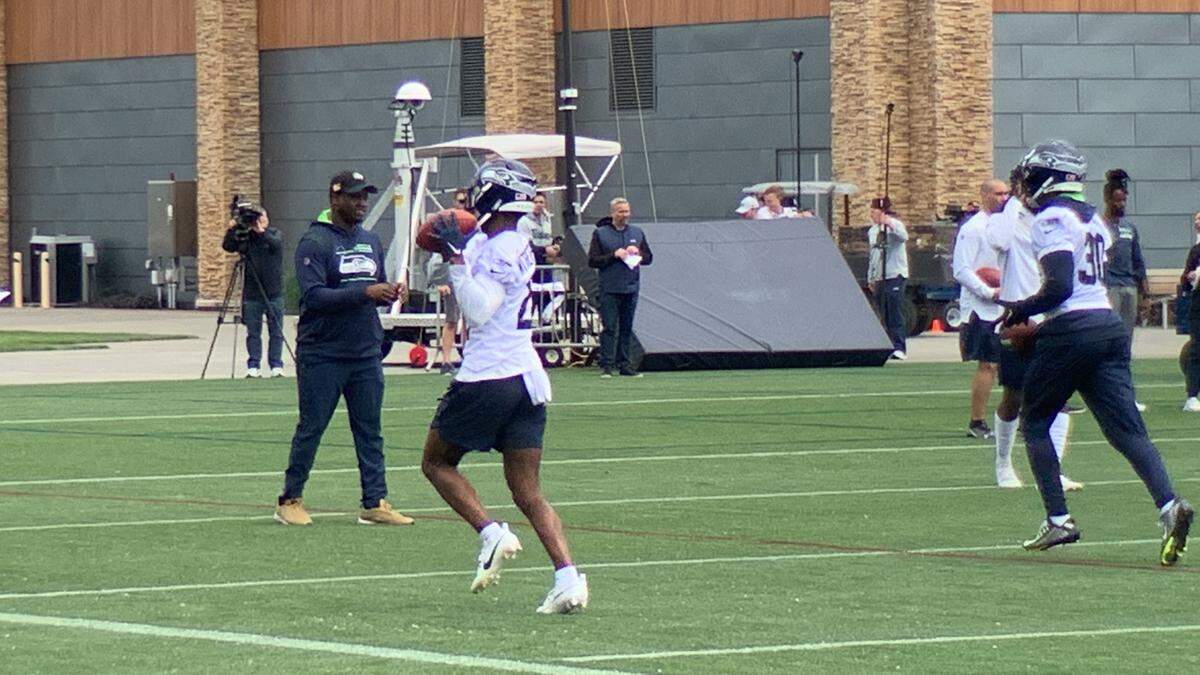 Rookie first-round draft choice Devon Witherspoon (21) and 2022 starting cornerback Michael Jackson (30) during the first of nine organized team activities (OTA) practices for the Seahawks at team headquarters in Renton May 22, 2023. Witherspoon and Jackson were the first-team cornerbacks while 2022 Pro Bowl rookie Tariq Woolen was away needing arthroscopic knee surgery.