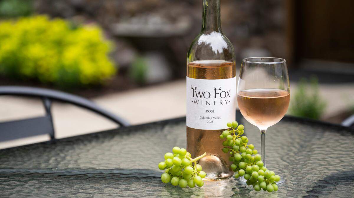 A bottle of Two Fox Winery’s 2021 rosé from Columbia Valley sits on a table outside of their pouring room at their vineyard in Lakebay, Wash. August 26, 2022.