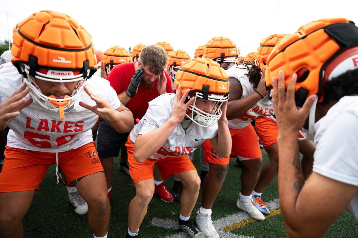 Lakes football team does a reaction time drill during practice at Lakes High School at Lakes High School, on Wednesday, Aug. 21, 2024, in Lakewood, Wash.