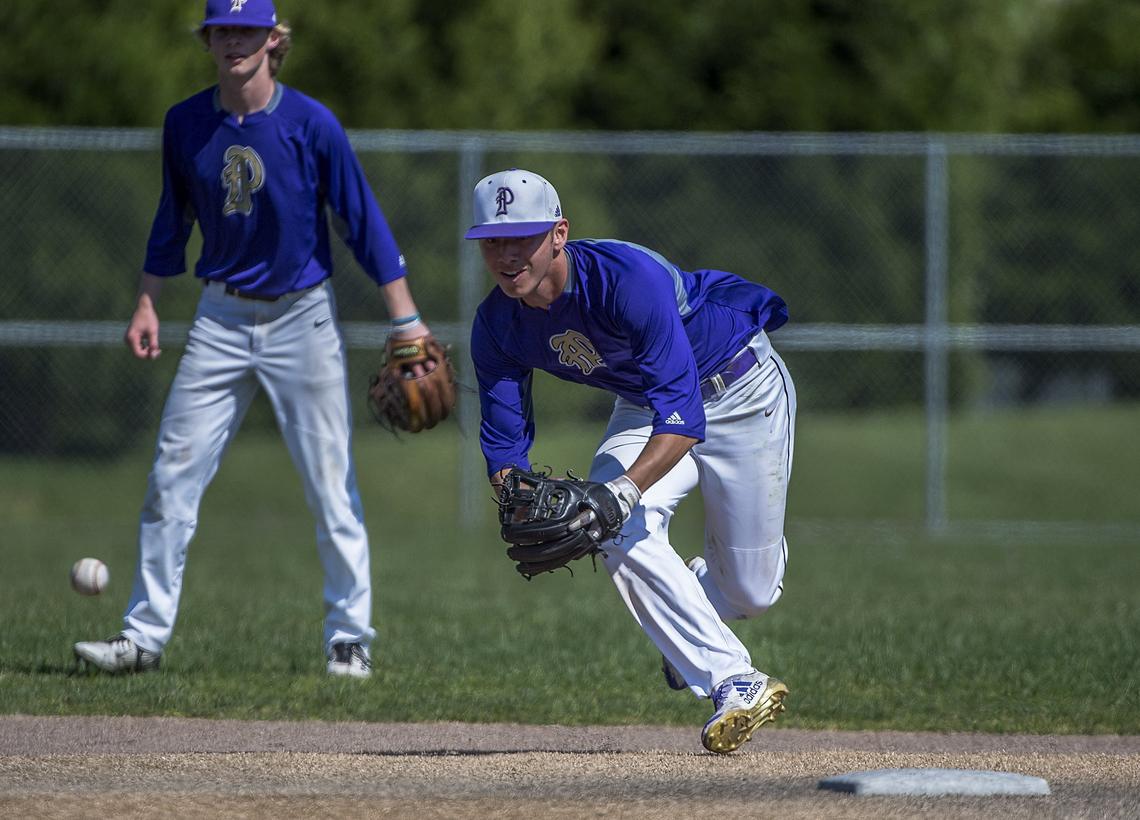 Shortstop Gavin Grant, an Oregon State commit, fields a ball during practice. The Puyallup High School baseball team were on the field at Heritage Recreation Center Tuesday, May 15, 2018. The Vikings are looking for back-to-back 4A state titles.