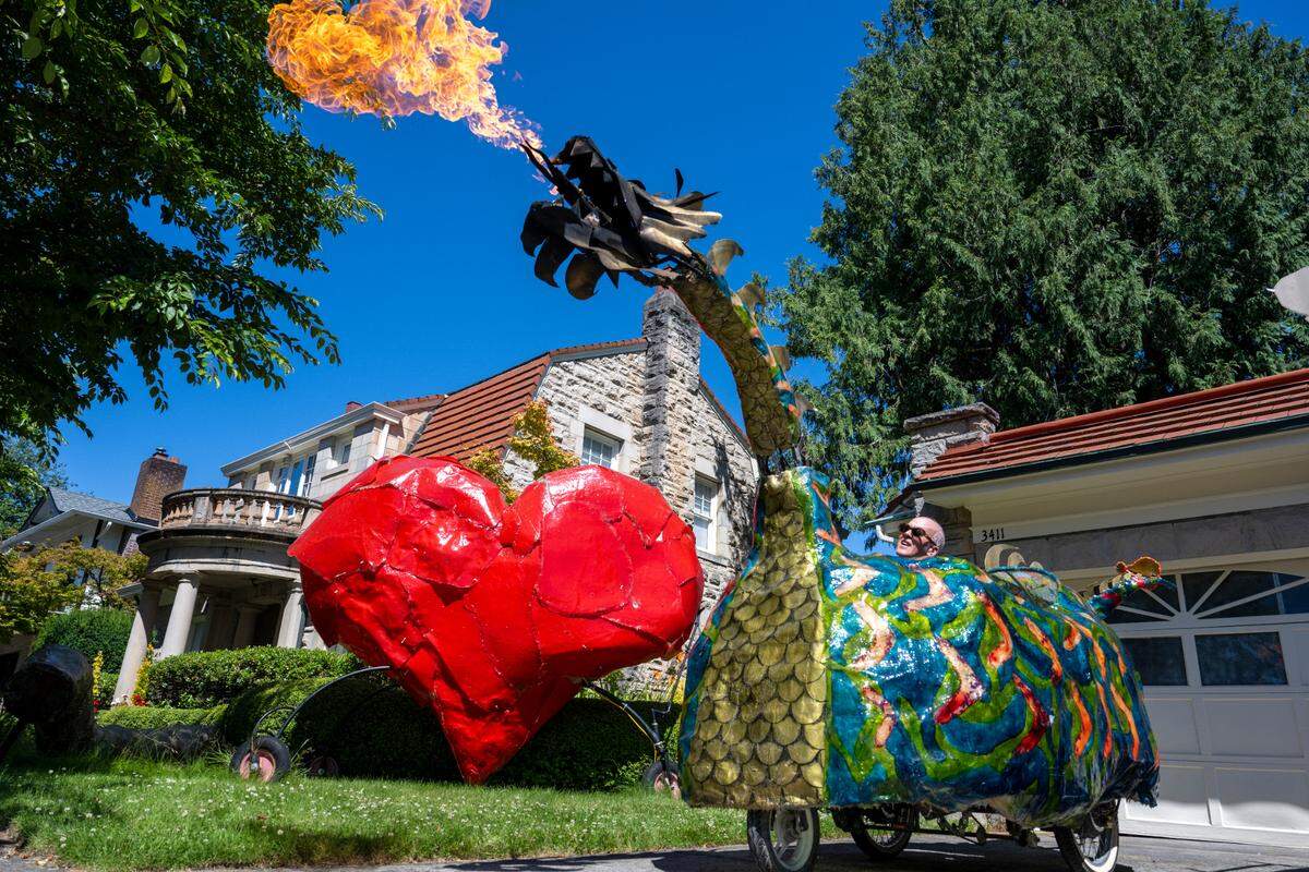 Steve LaBerge operates his fire-breathing dragon, which will make its annual appearance at the Tacoma Porchfest parade. Shown in his driveway on Monday, July 7, 2025, in Tacoma.