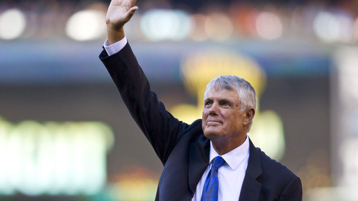 Former Seattle Mariners manager Lou Piniella waves as he enters the field for his induction into the Mariners Hall of Fame before a baseball game between the Chicago White Sox and the Mariners in Seattle on Saturday, Aug. 9, 2014. (AP Photo/John Froschauer)