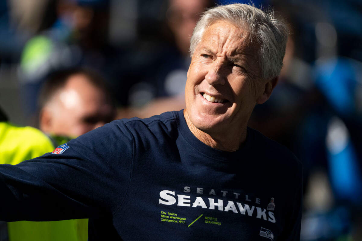 Seattle Seahawks head coach Pete Carroll waves at fans as he walks onto the field prior to the start of an NFL game against the Arizona Cardinals on Sunday, Oct. 16, 2022, at Lumen Field in Seattle.